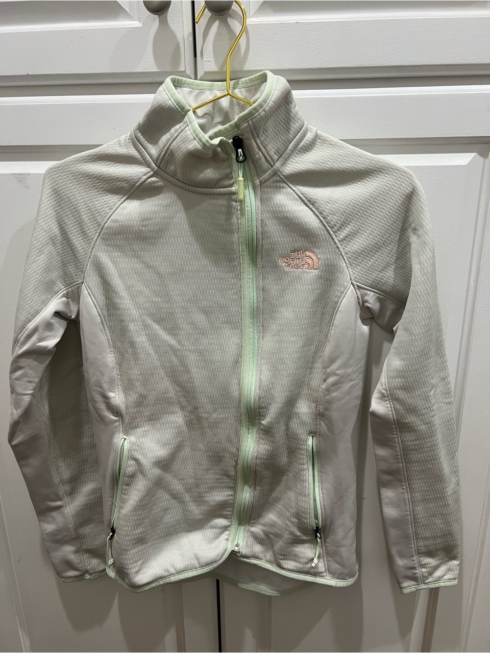 The North Face women's Cream Jacket with Pale Mint Accents